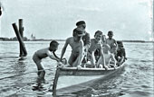 Boys climbing into a rowboat / Мальчики, забирающиеся в лодку