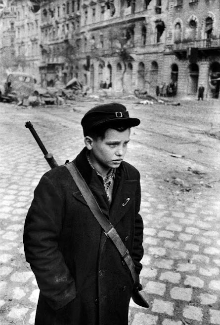 On a man's mission, Pal Pruck, 15, was one of the many brave teen-agers who fought in the revolution (Выполняя мужскую миссию, 15-летний Пал Прук был одним из многих храбрых подростков, участвовавших в революции), 1956