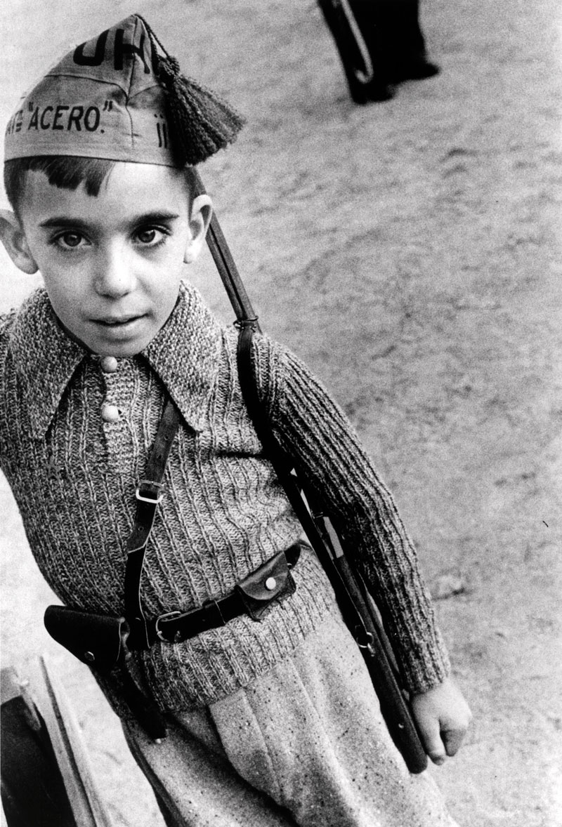 Little boy with steel battalion cap from the Union of Proletarian Brothers (Мальчик в пилотке батальона Союза Братских Пролетариев), October 1936